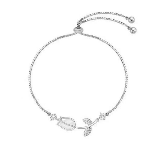 1 elegante bracciale floreale retrò da donna realizzato in acciaio inox color oro, con motivo floreale nero e bianco. È il regalo perfetto per San Valentino o per outfit casual.